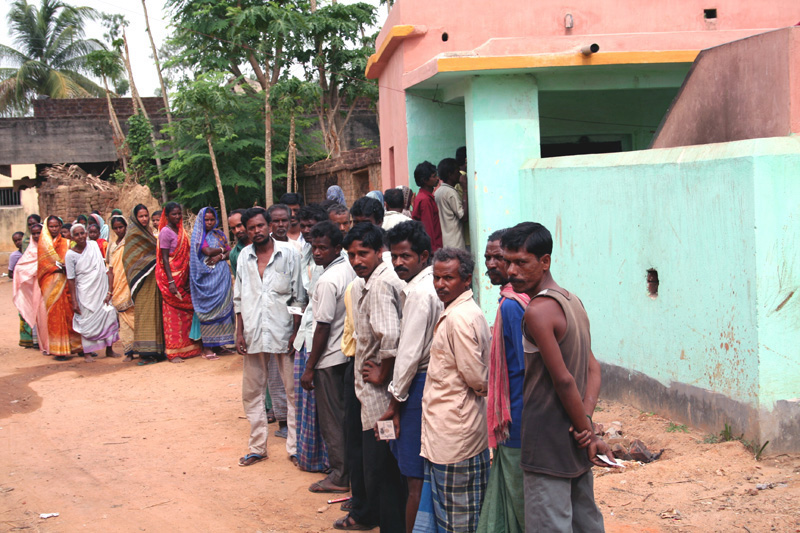 Indian voters queue at a rural polling station